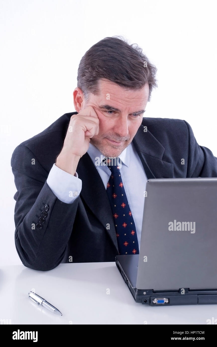 Model release , Geschaeftsmann, 50+, bei der Arbeit am Laptop - businessman at office Stock Photo