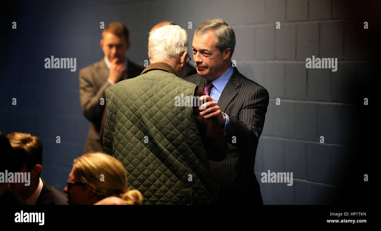 Former leader Nigel Farage is greeted by a delegate attending the Ukip spring conference in Bolton. Stock Photo