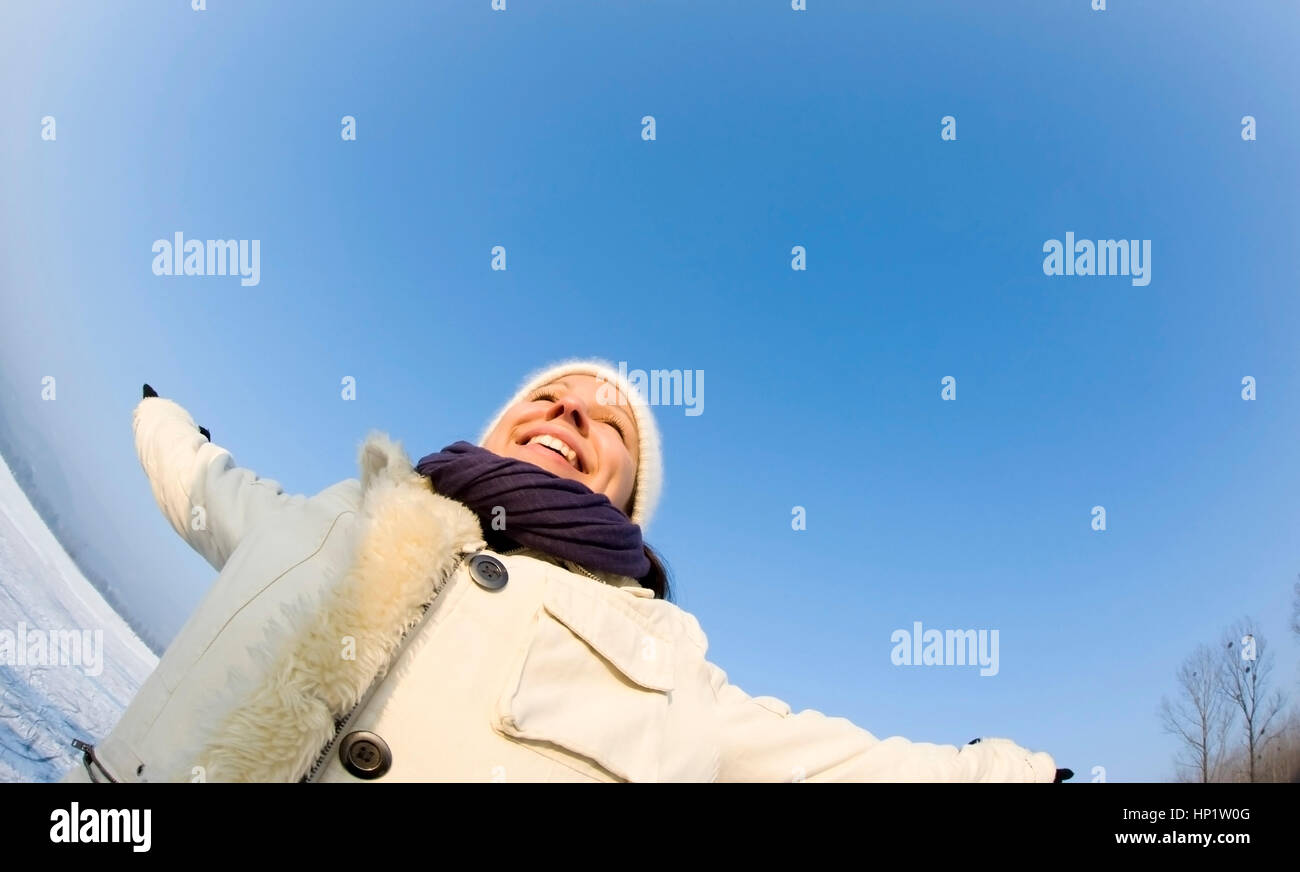 Model release , Junge Frau geniesst den Winter - woman in winter Stock Photo