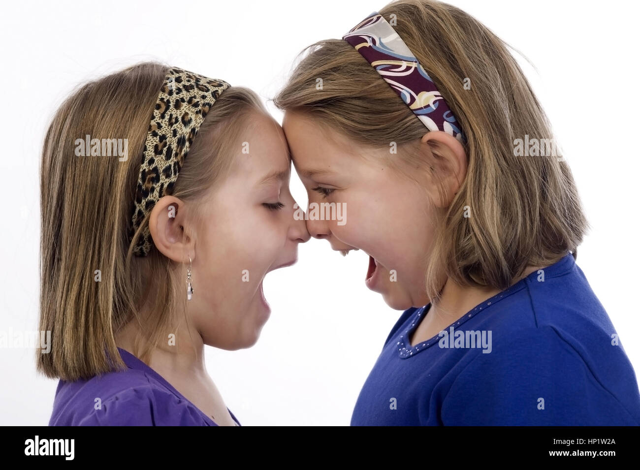 Model release , Zwei Maedchen schreien sich an - girls scream each other Stock Photo