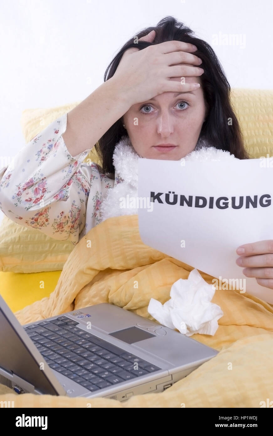 Model release , Kranke Frau im Bett mit Kuendigung in der Hand - sick woman in bed with letter of cancellation in hand Stock Photo