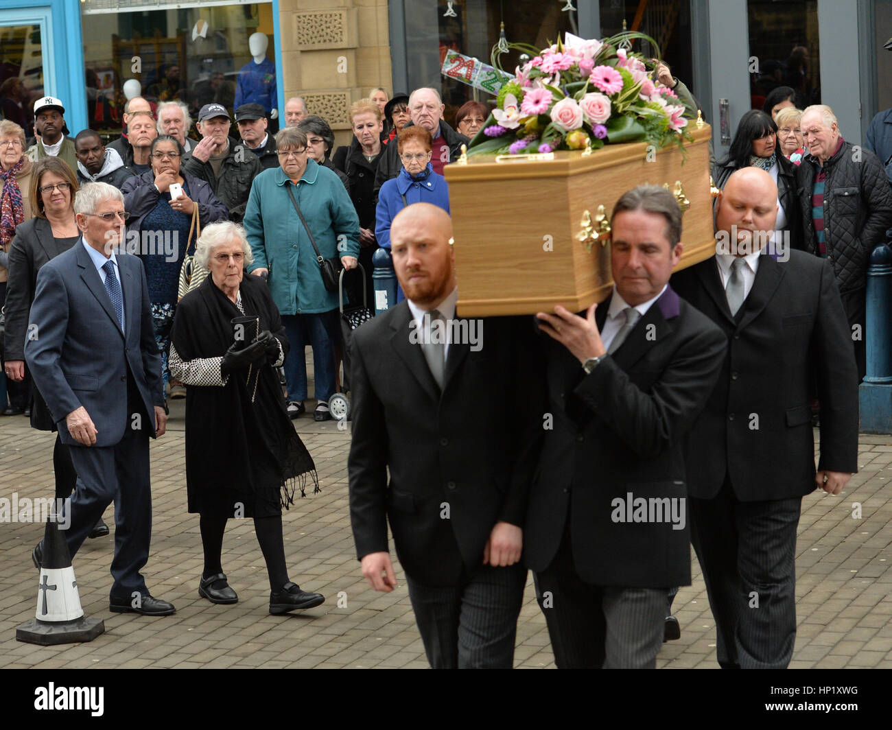 Sheila Shuttleworth, cousin of 'Allo 'Allo star Gorden Kaye follows his coffin as it is carried into Huddersfield Parish Church for his funeral service. Stock Photo