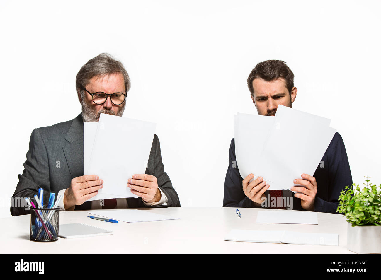 Two Team Members The two colleagues working together at office on white background Stock ...