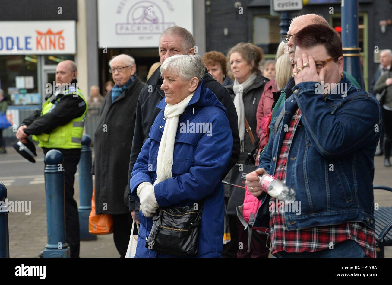 Members of the public gather outside Huddersfield Parish Church, during the funeral service of 'Allo 'Allo star Gorden Kaye. Stock Photo
