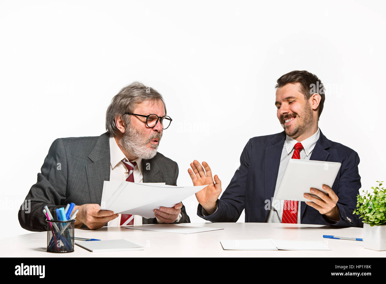 Two Team Members The two colleagues working together at office on white background Stock ...