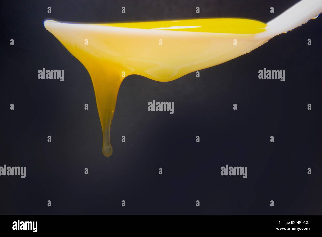 Teaspoon with honey Stock Photo