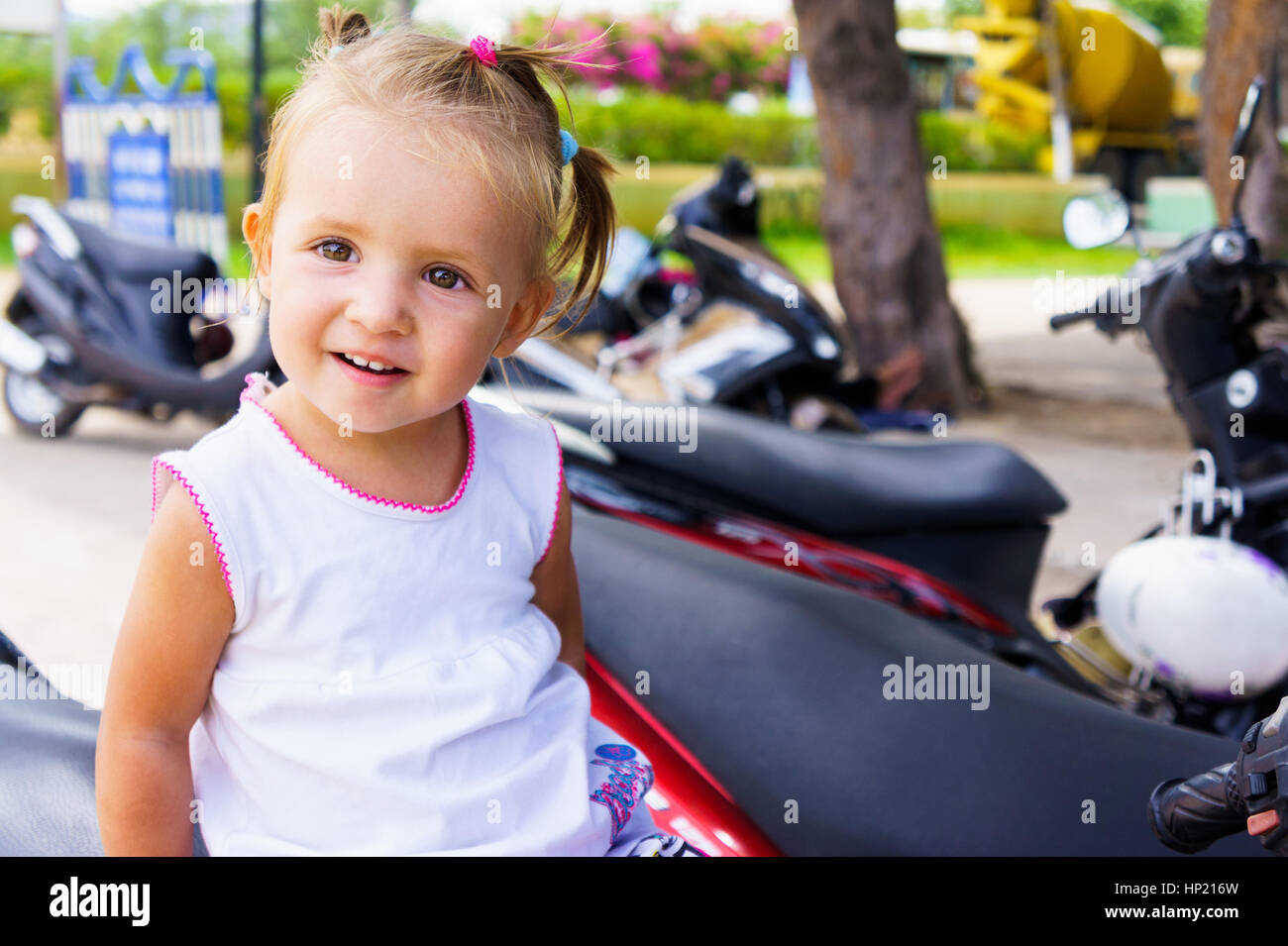 Cute little girl smiling in summer day Stock Photo - Alamy