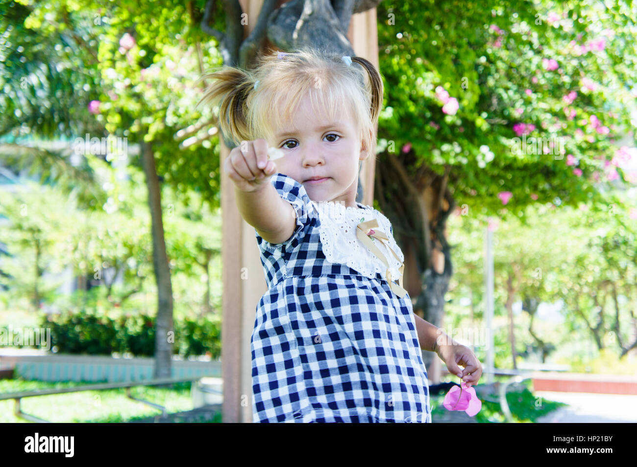 Cute little girl smiling in summer day Stock Photo - Alamy