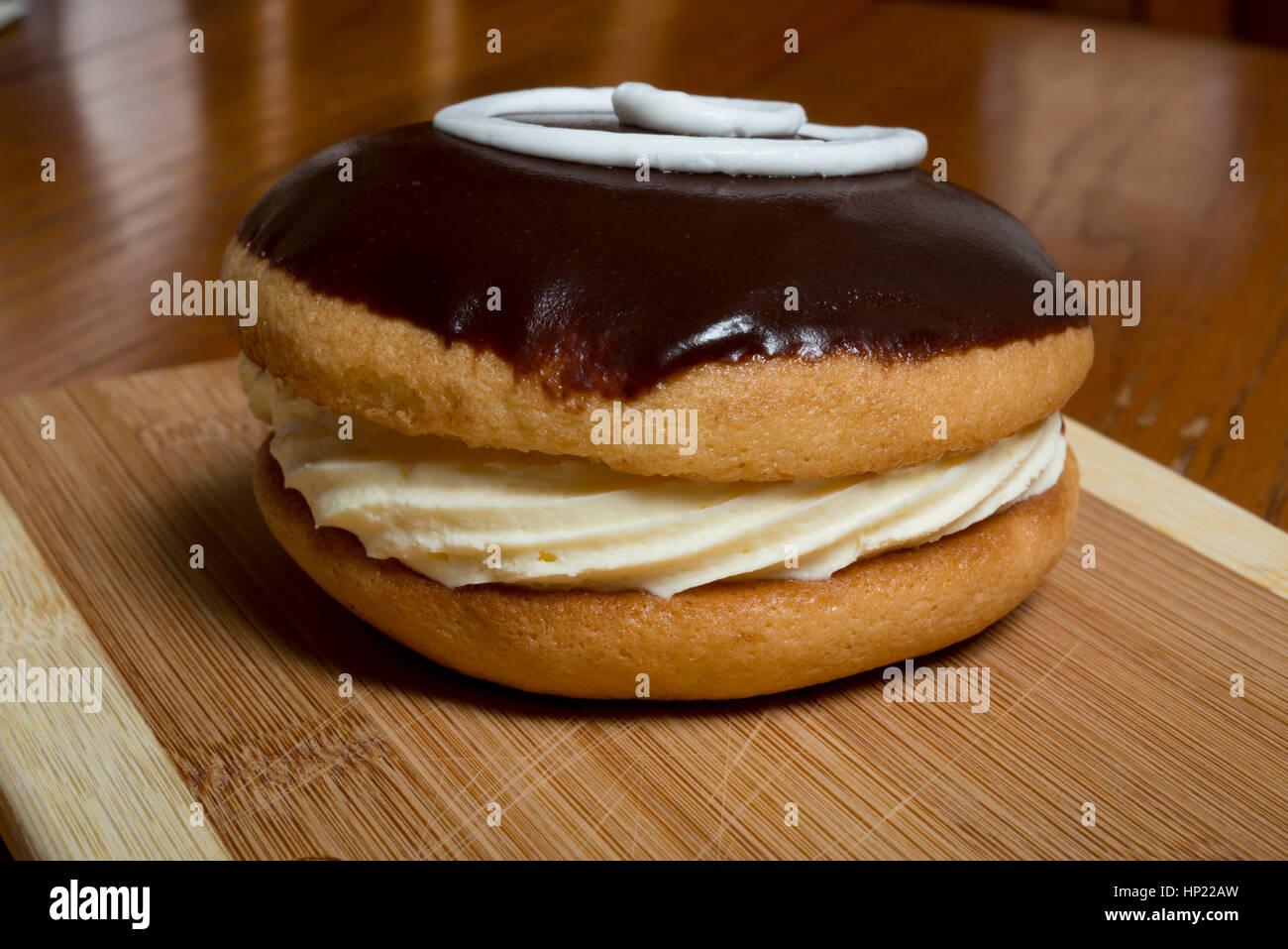 round eclair chocolate with cream filling Stock Photo