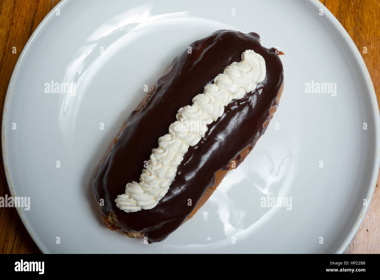 long chocolate eclair with ising Stock Photo