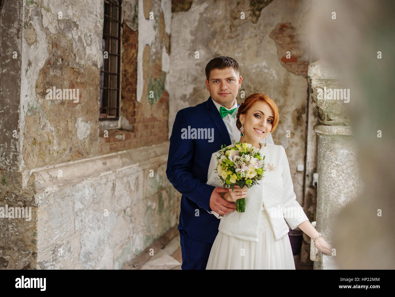 Wedding couple in love background old vintage stone wall. Stock Photo