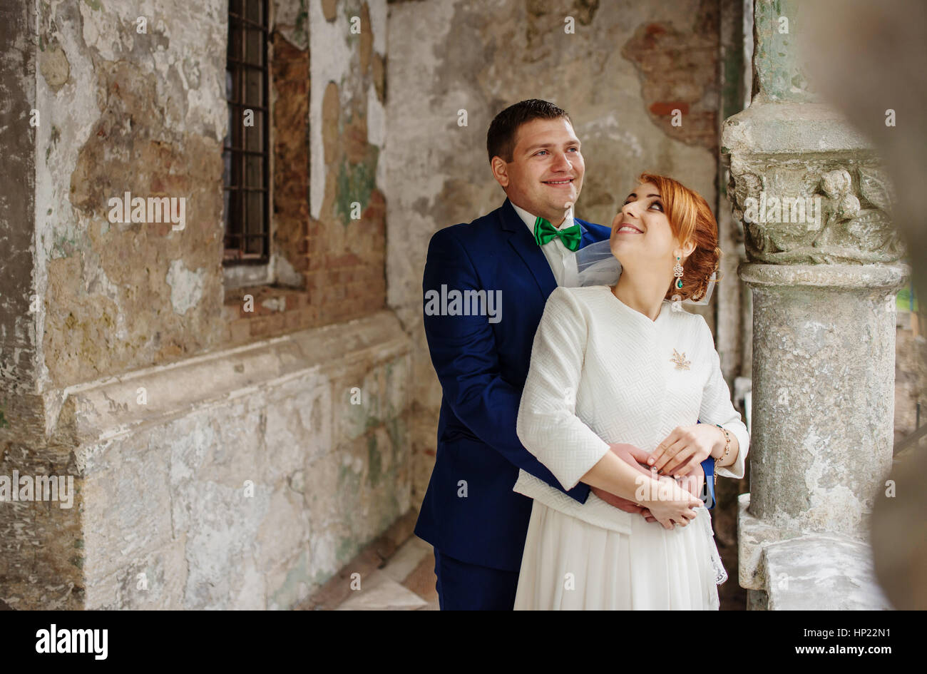 Wedding couple in love background old vintage stone wall. Stock Photo