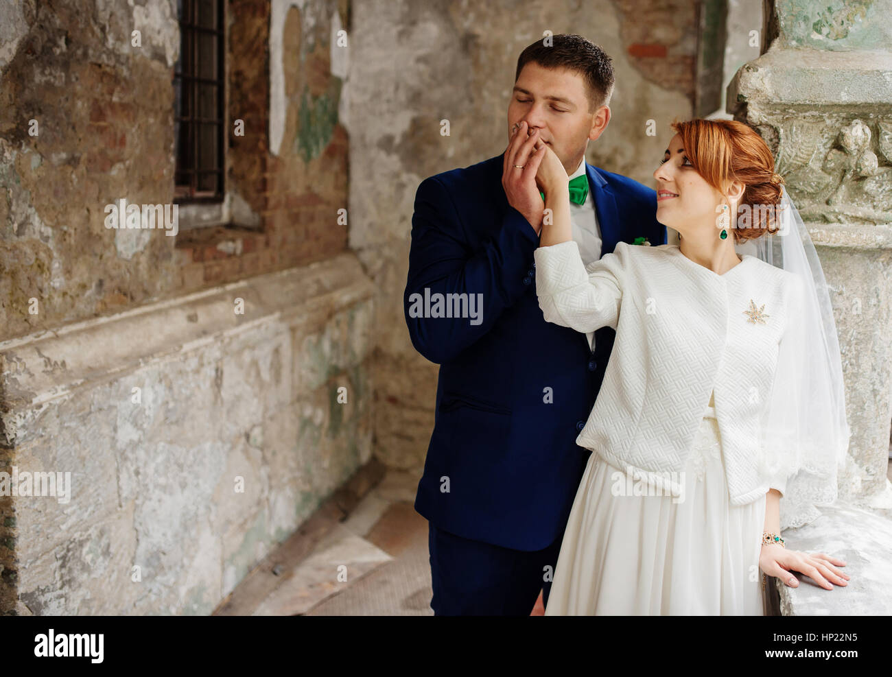 Wedding couple in love background old vintage stone wall. Stock Photo