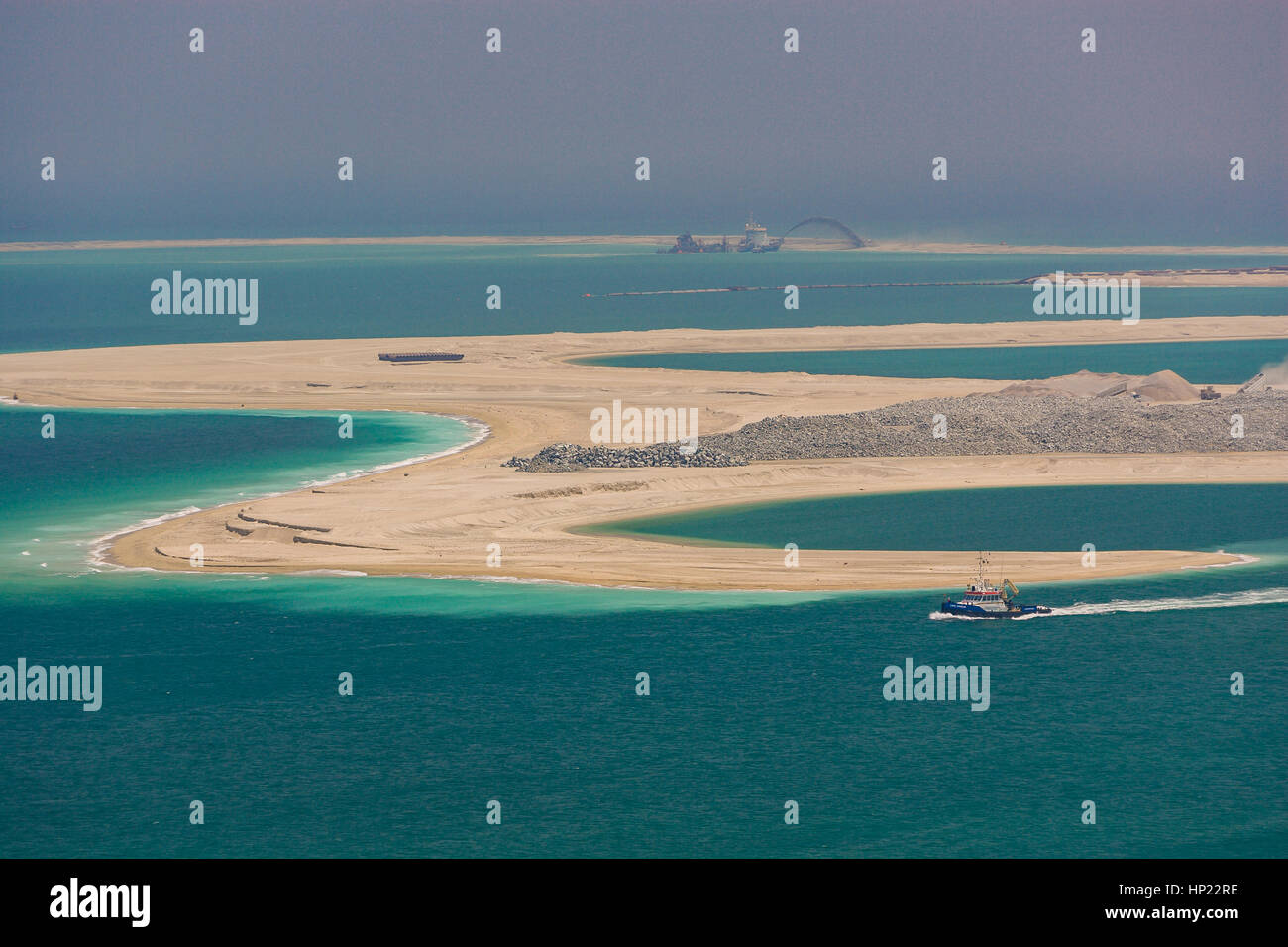 DUBAI, UNITED ARAB EMIRATES - Land reclamation in progress, creating new land area in Gulf, for development. Stock Photo