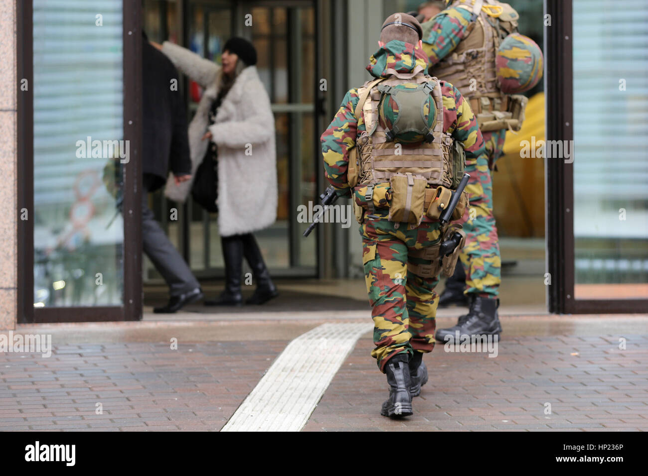 Belgian soldiers guard European institutions. Unrecognisable people in uniforms. Security measures after the attacks in Brussels of 2016. From the bac Stock Photo