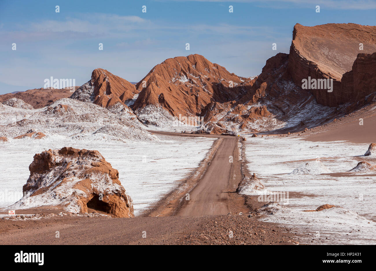 track, road, across of Valle de la Luna (Valley of the Moon ) and salt deposited on the ground, Atacama desert. Region de Antofagasta. Chile Stock Photo