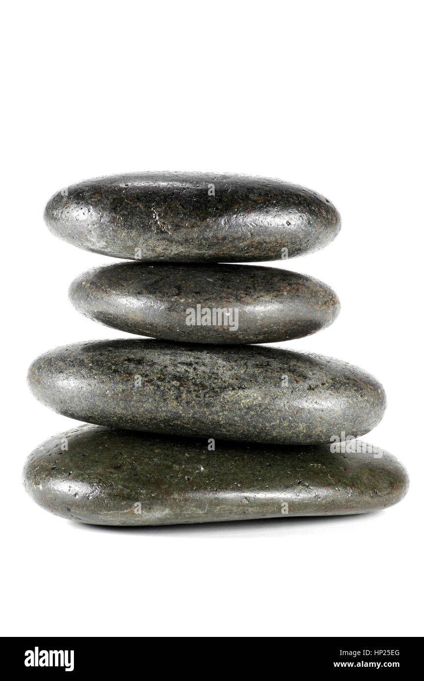 basalt stones for hot stone massage isolated on white background Stock Photo