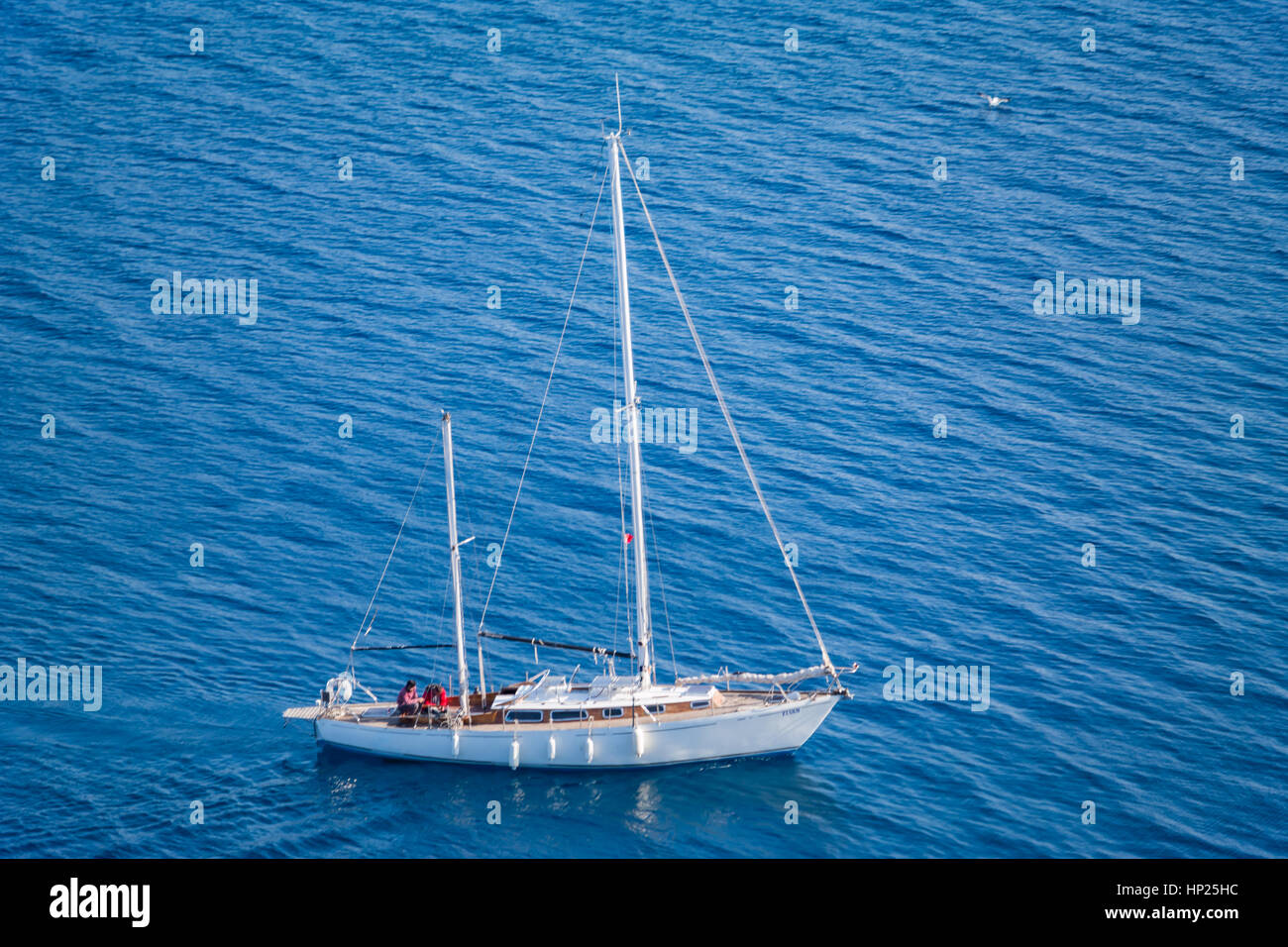 white sail boat sailing in the sea, denizde beyaz yelkenli Stock Photo