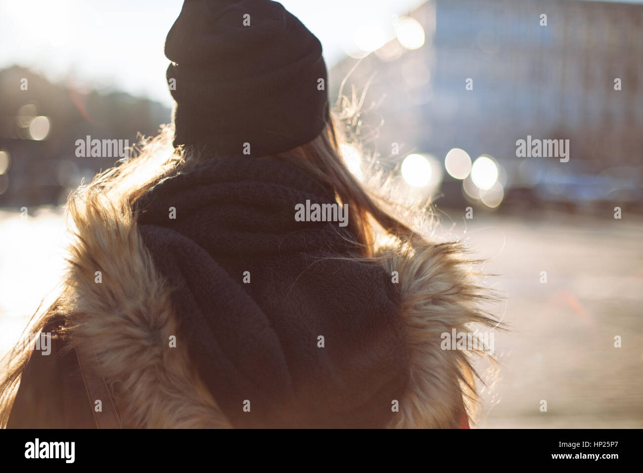 Back view of a hipster girl walking on city street Stock Photo - Alamy