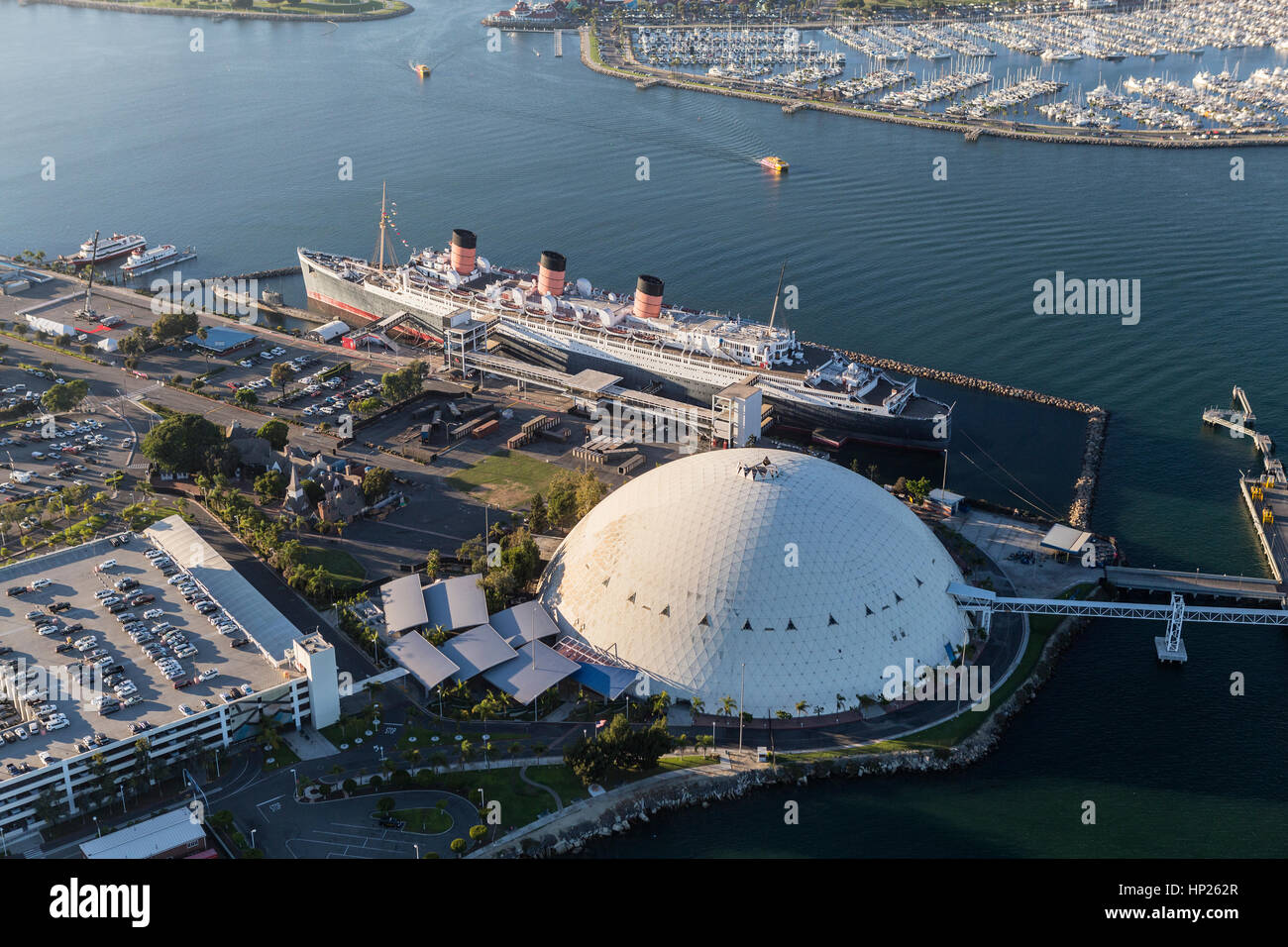 Long Beach, California, USA - August 16, 2016:  Aerial view of the historic Queen Mary and cruise ship terminal dome. Stock Photo