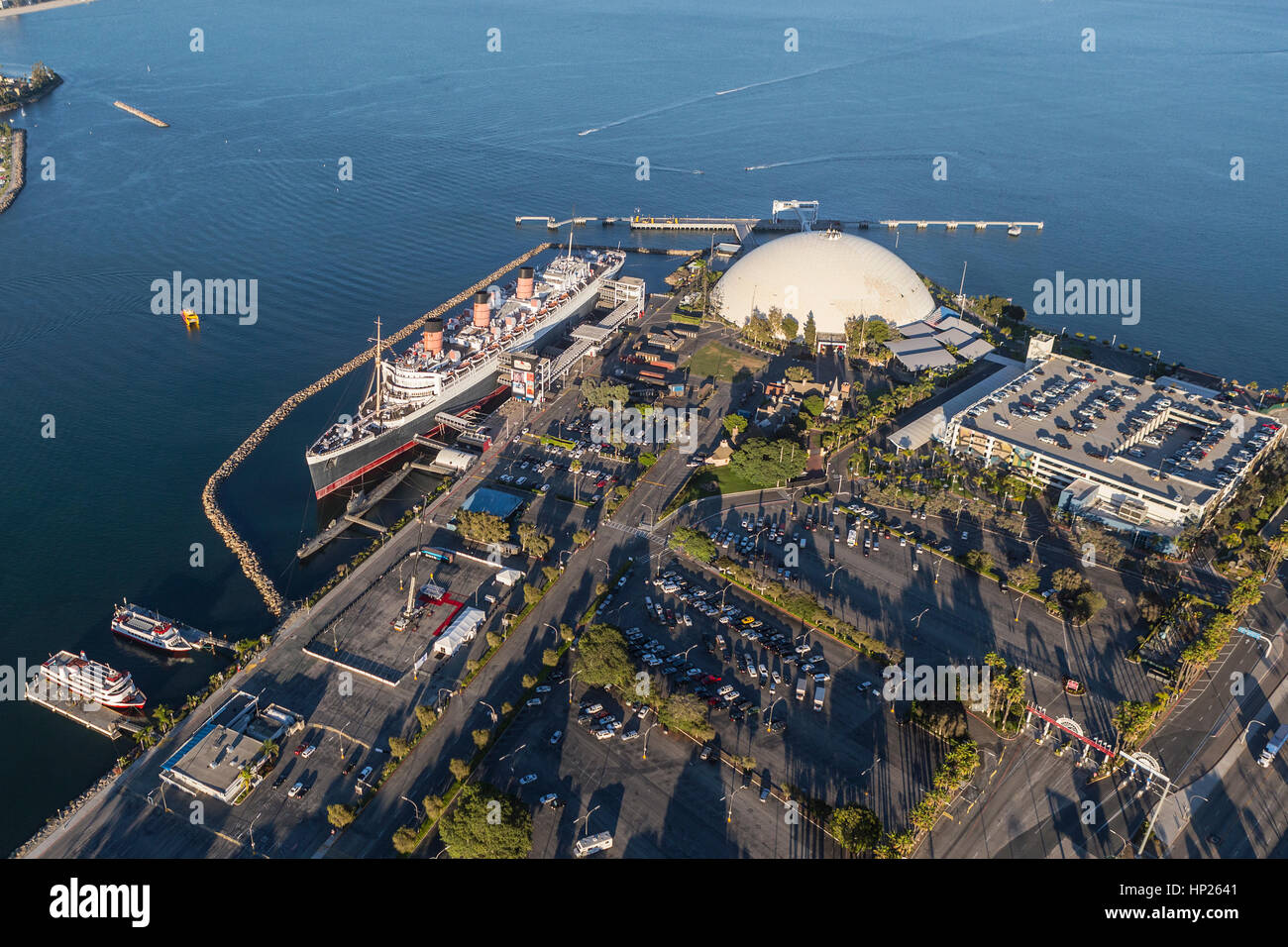 Long Beach, California, USA - August 16, 2016:  Afternoon aerial view of the Queen Mary and neighboring cruise ship terminal dome. Stock Photo