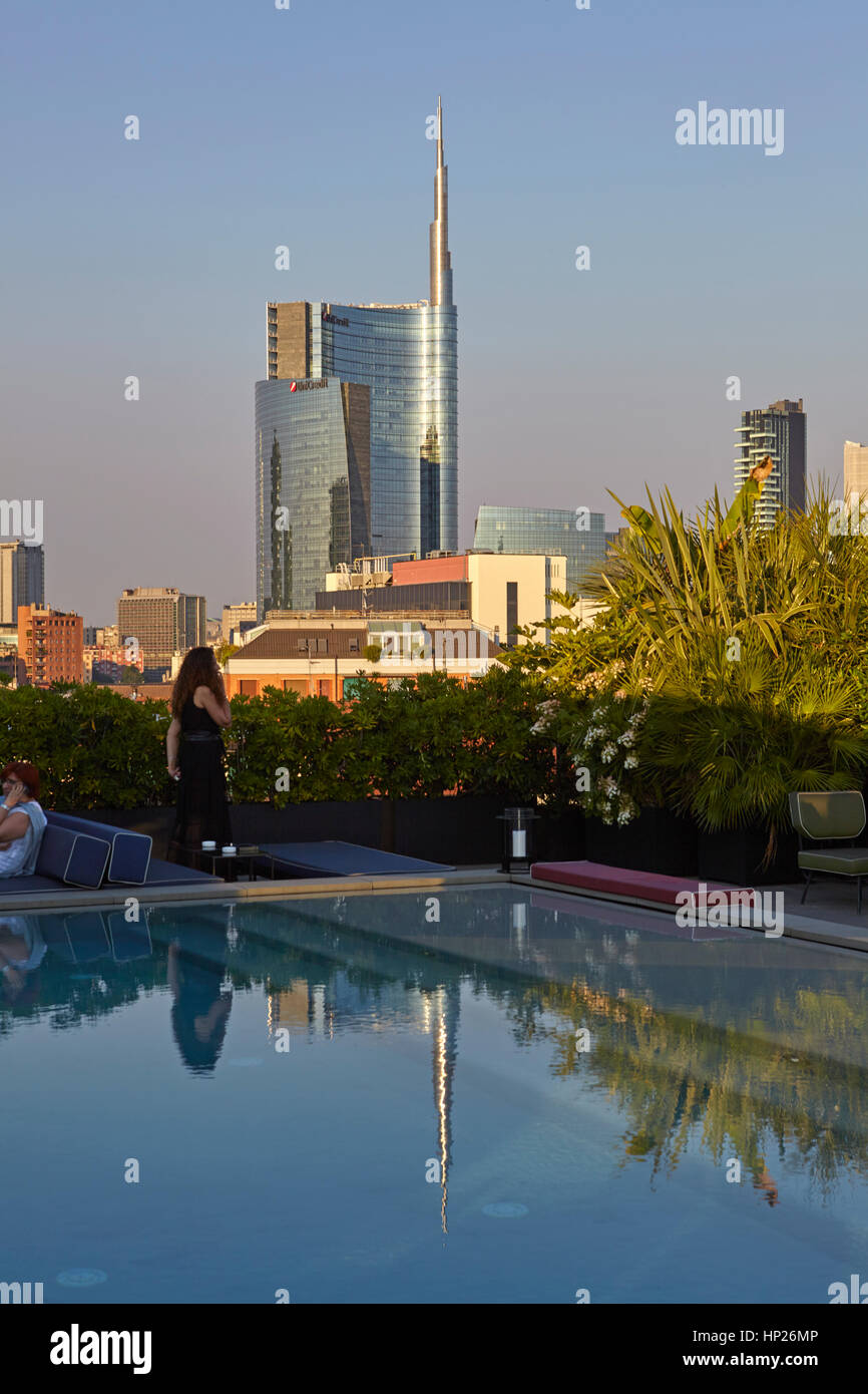 View of Unicredit Tower in Porta Nuova district with the swimmingpool in the foreground, Milan, Italy Stock Photo