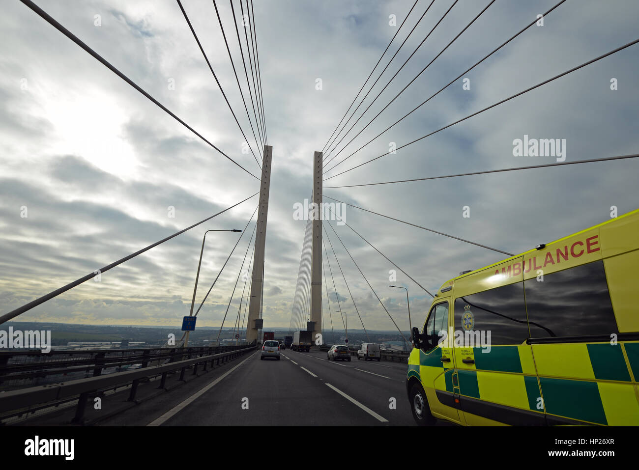 An ambulance travelling over the Queen Elizabeth II 'Dartford' bridge, from Essex to Kent, UK. Space for copy Stock Photo
