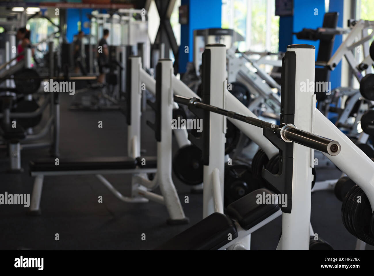Gym with big windows and heavy weight equipment. Modern fitness bright club Stock Photo