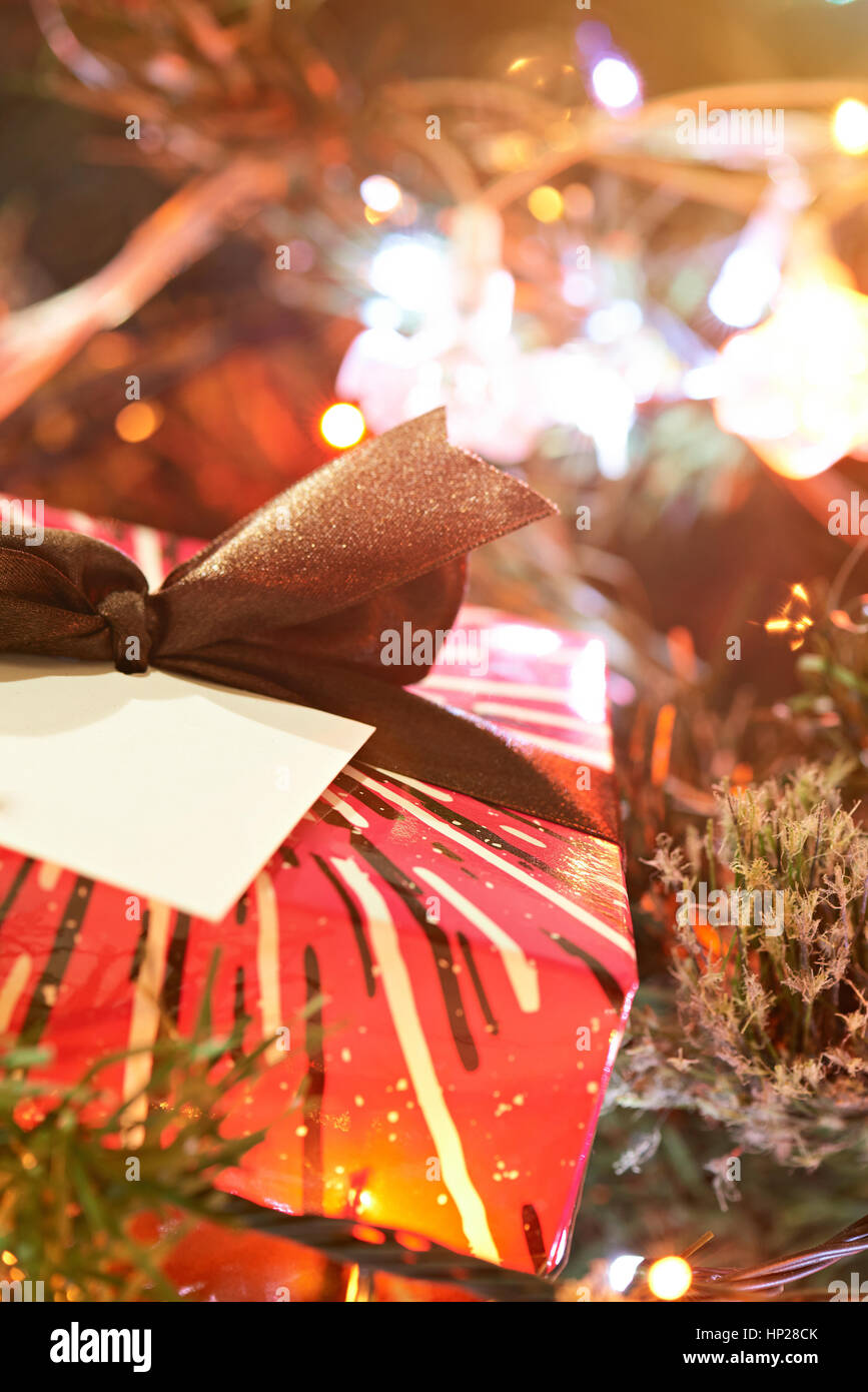 close up of christmas gift box on blurred decoration background Stock Photo