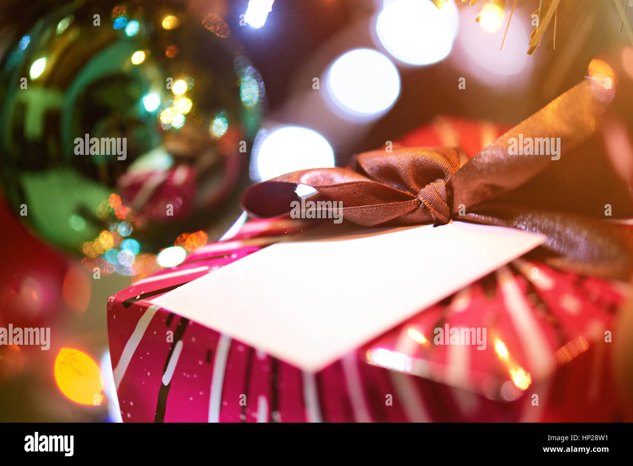 new year present box close up on blurred lights background Stock Photo