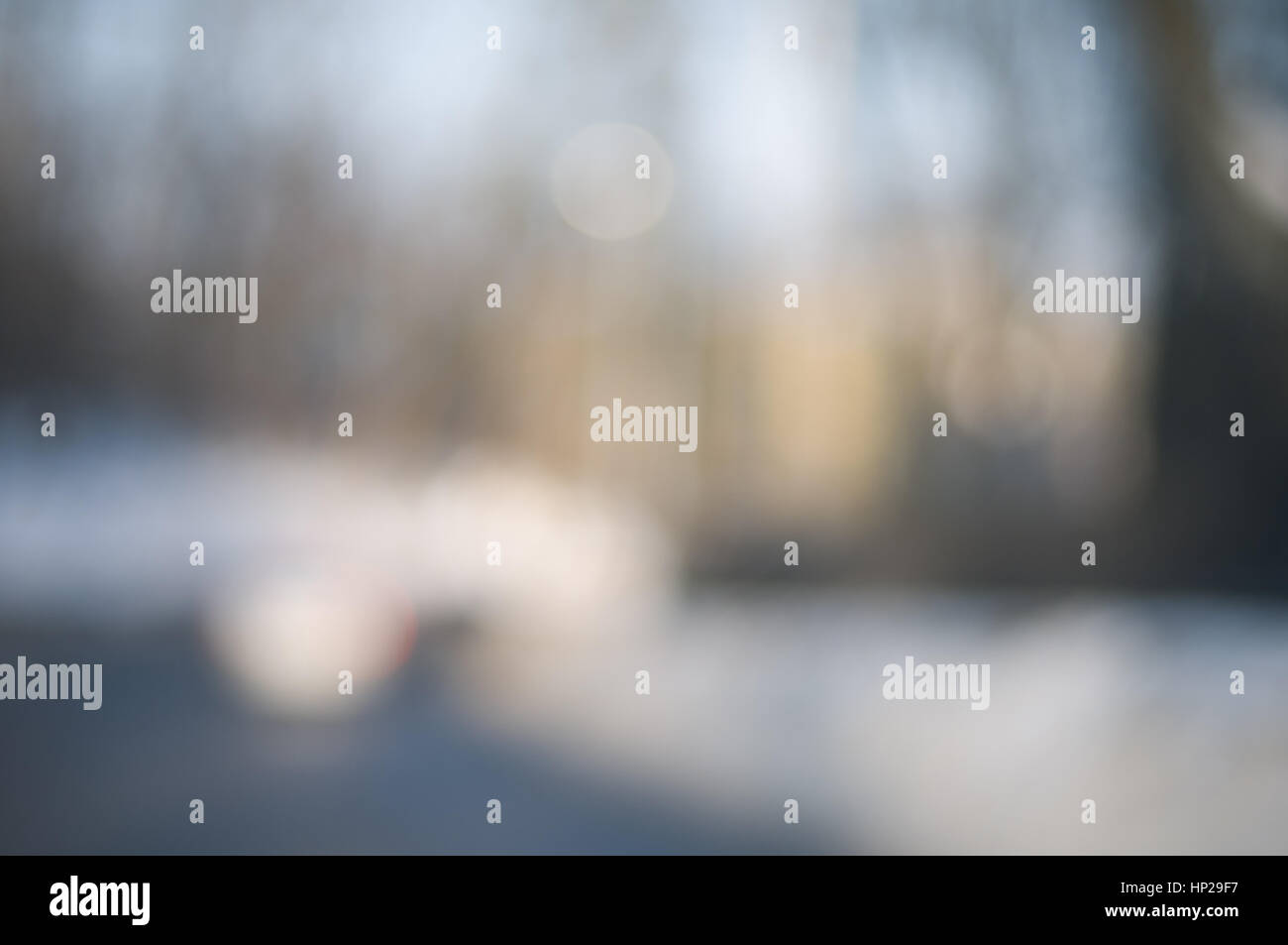 Abstract background with blurry buildings, street signs and cars in ...