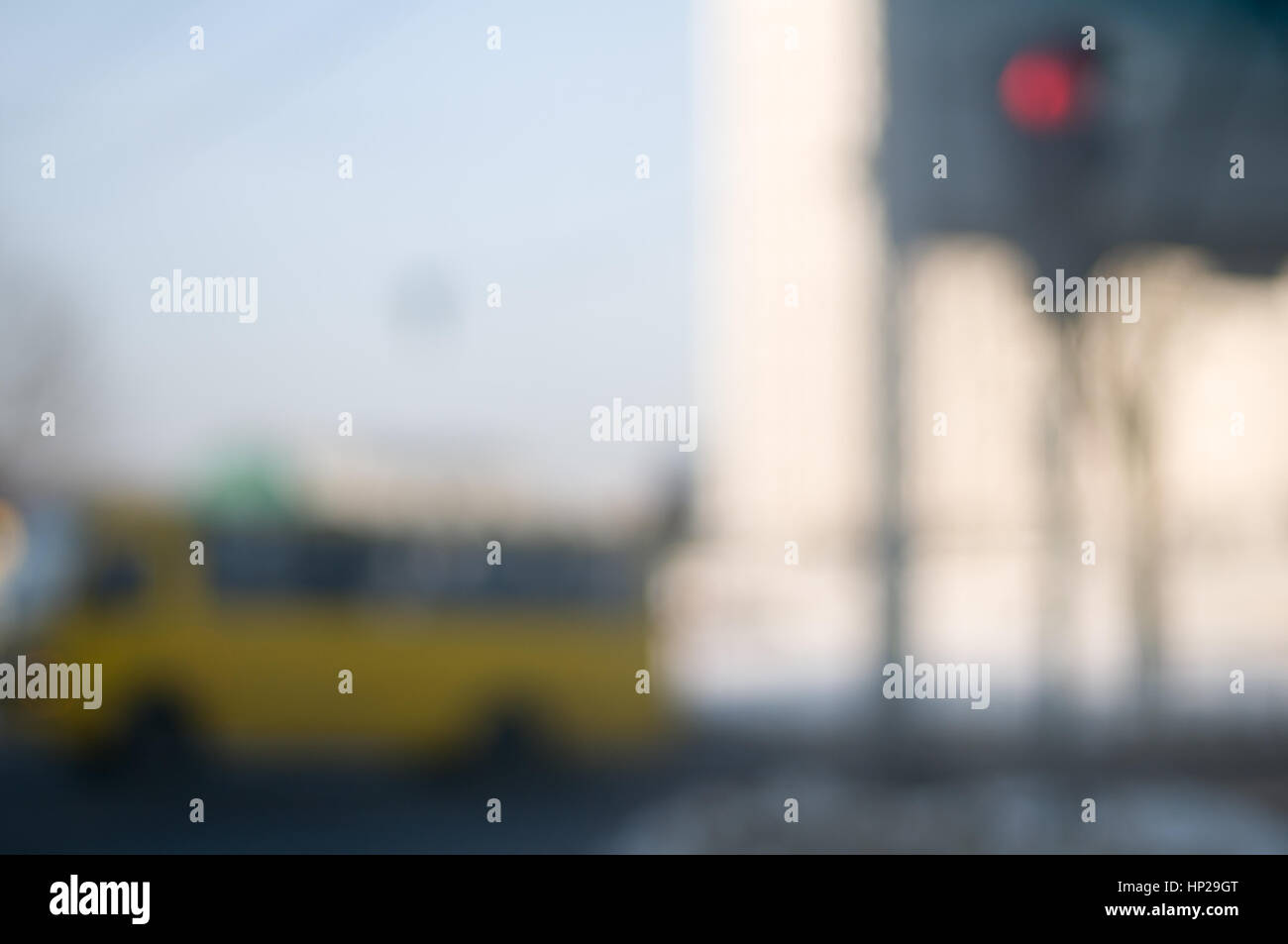 Traffic abstract background with blurry buildings, street signs and ...