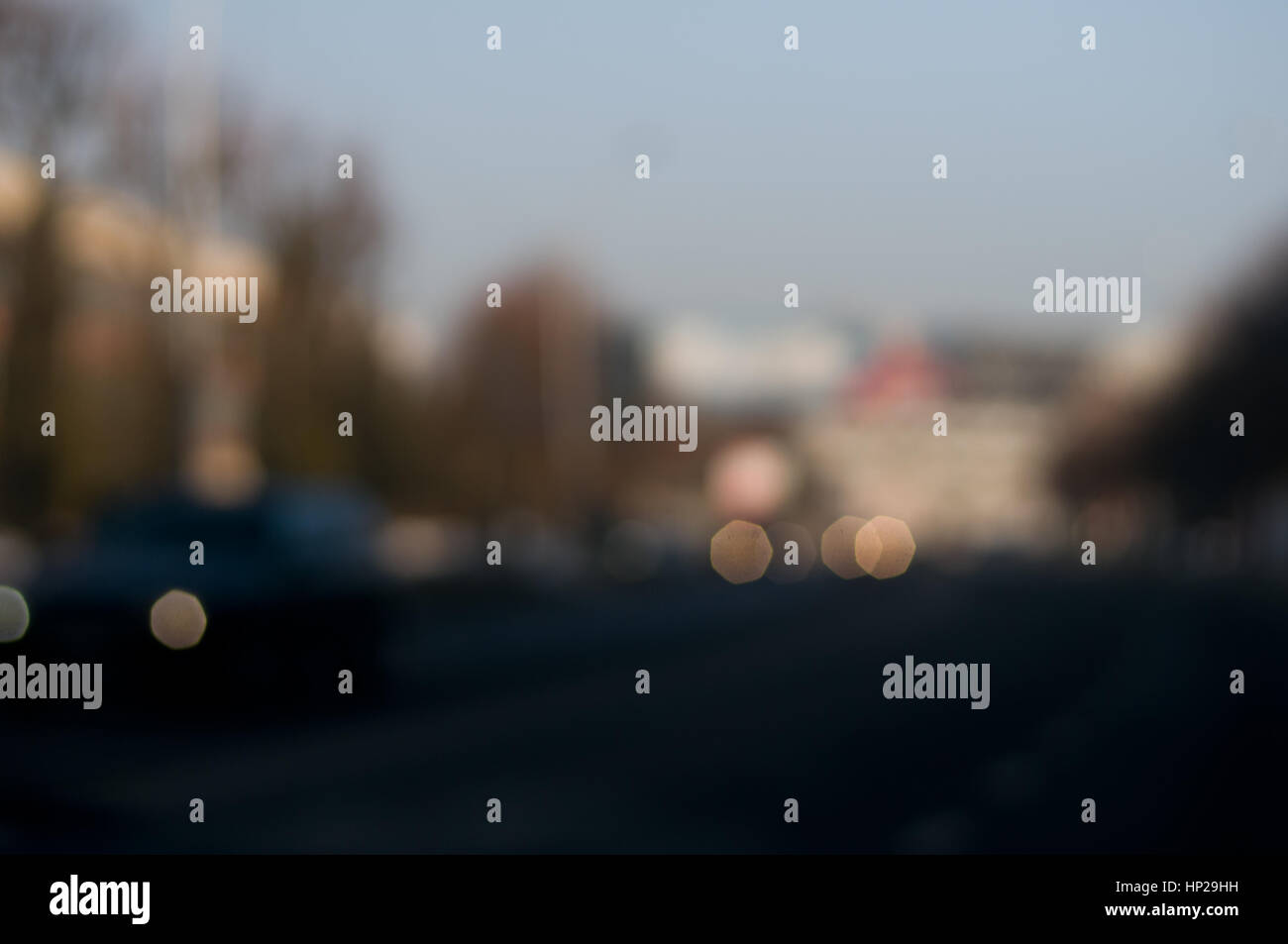 Traffic abstract background with blurry buildings, street signs and ...