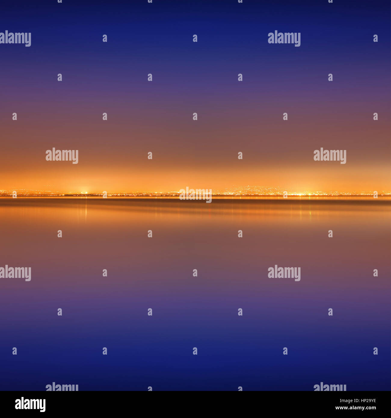 Golden city lights during the blue hour Stock Photo