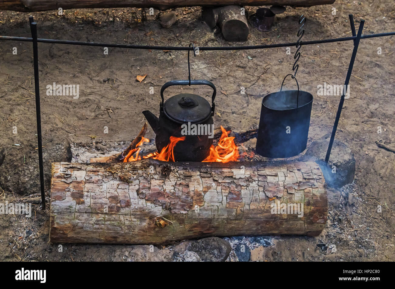 https://c8.alamy.com/comp/HP2C80/teapot-and-kettle-on-a-campfire-HP2C80.jpg