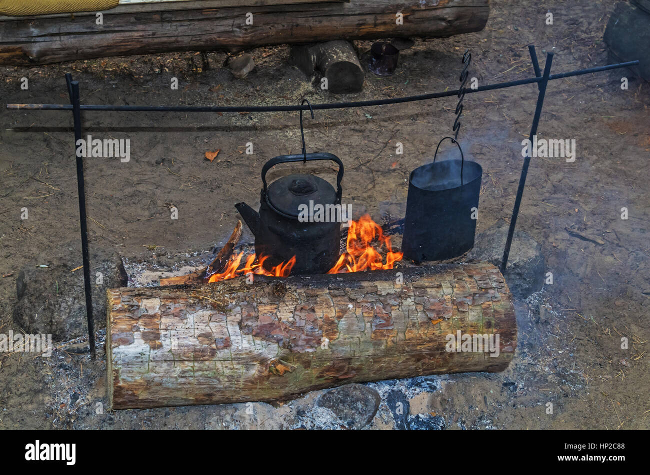 Teapot and kettle on a campfire Stock Photo Alamy