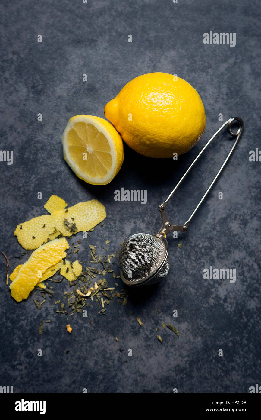 Green tea with lemon zest, black background Stock Photo Alamy