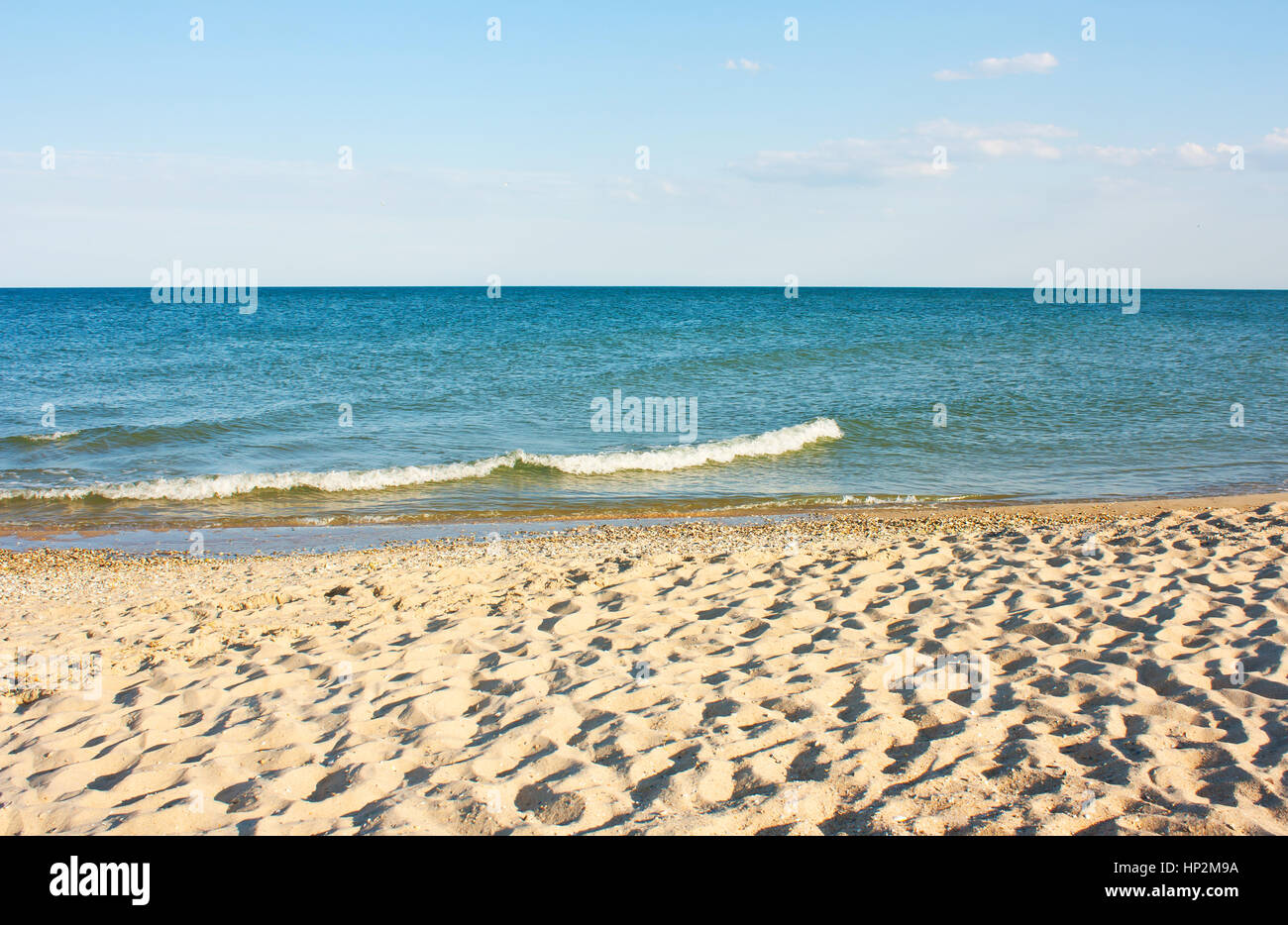 Beautiful sandy beach and the sea, blue sky Stock Photo - Alamy
