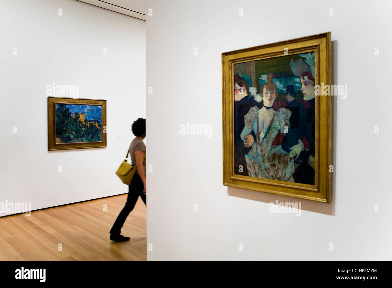MoMA ( Museum of Modern Art).Right, Henri Toulouse Lautrec, La goulveat the moulin rouge. Left, Paul Cézane, Châteurnoir,New York City, USA Stock Photo