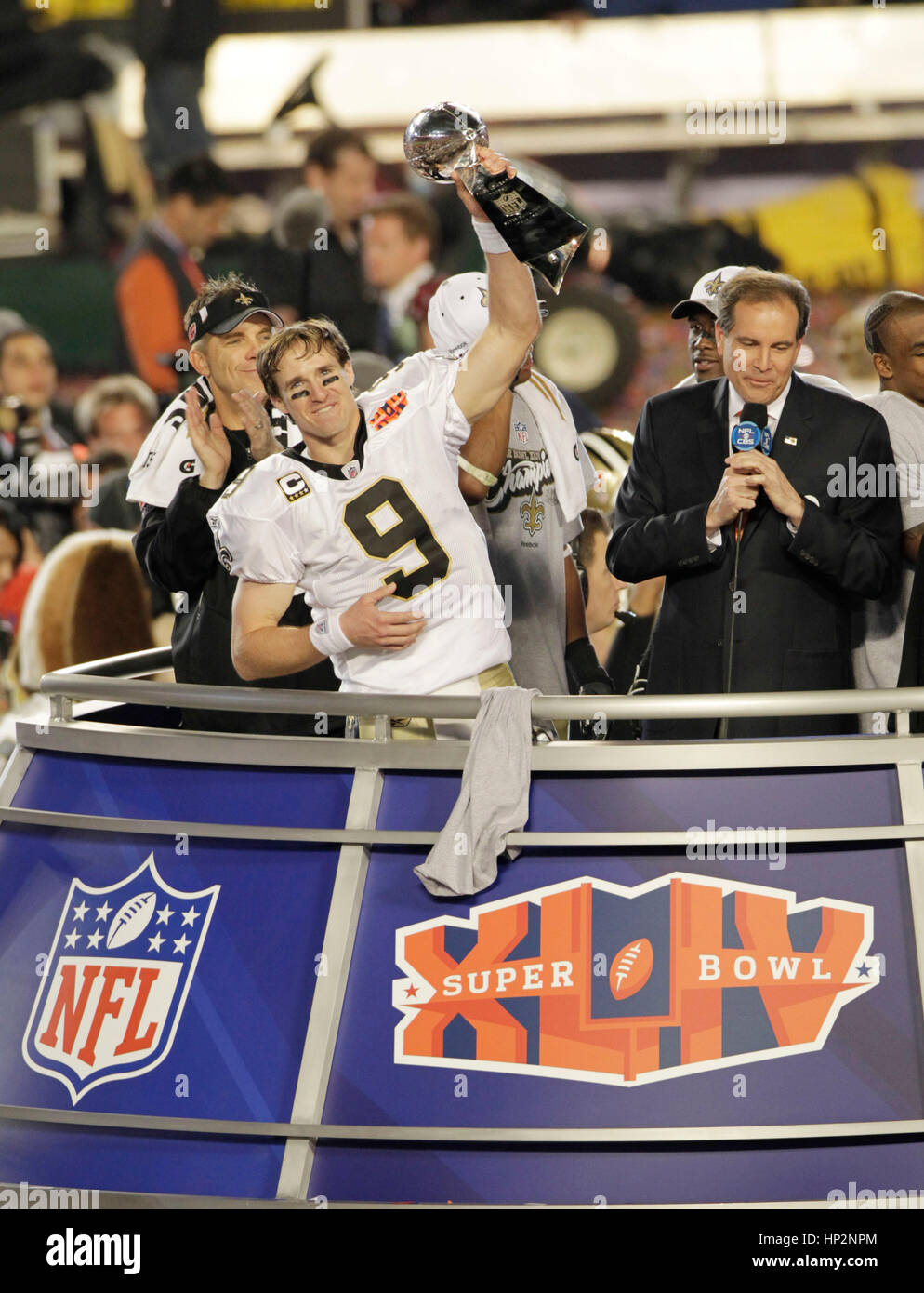 New Orleans Saints quarterback Dree Brees holds the Vince Lombardi Trophy at the Super Bowl in Miami, Florida on February 7, 2010. Photo by Francis Specker Stock Photo