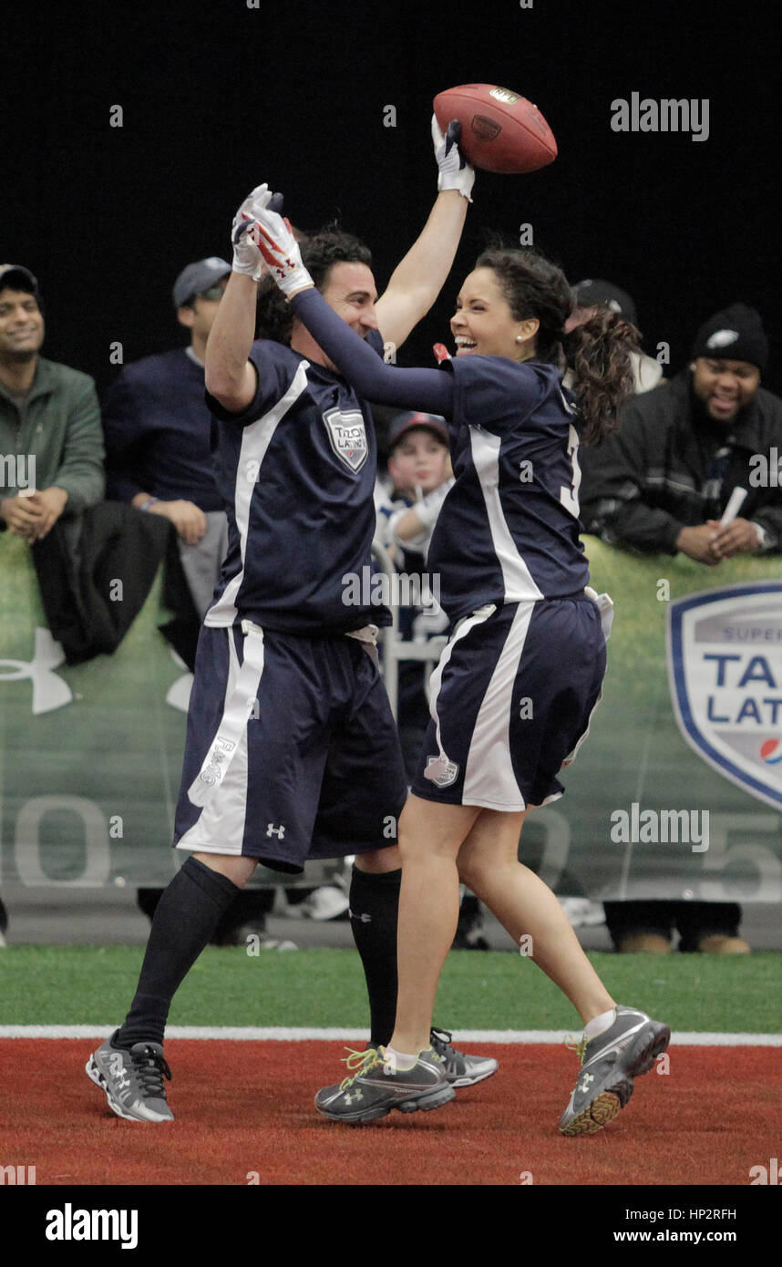 Martin Gramatica, left, celebrates his touch down with Susie Castillo at the Tazon Latino V flag football game at Super Bowl NFL Experience at the Dallas Convention Center on February 2, 2011 in Dallas, Texas. Photo by Francis Specker Stock Photo
