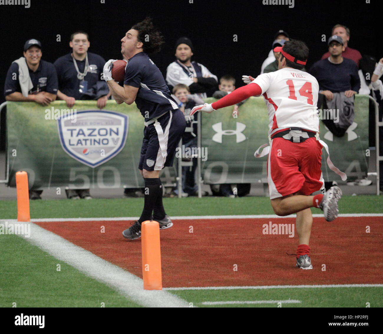 Martin Gramatica, left, scores a touch down over Felipe Viel at the Tazon Latino V flag football game at Super Bowl NFL Experience at the Dallas Convention Center on February 2, 2011 in Dallas, Texas. Photo by Francis Specker Stock Photo