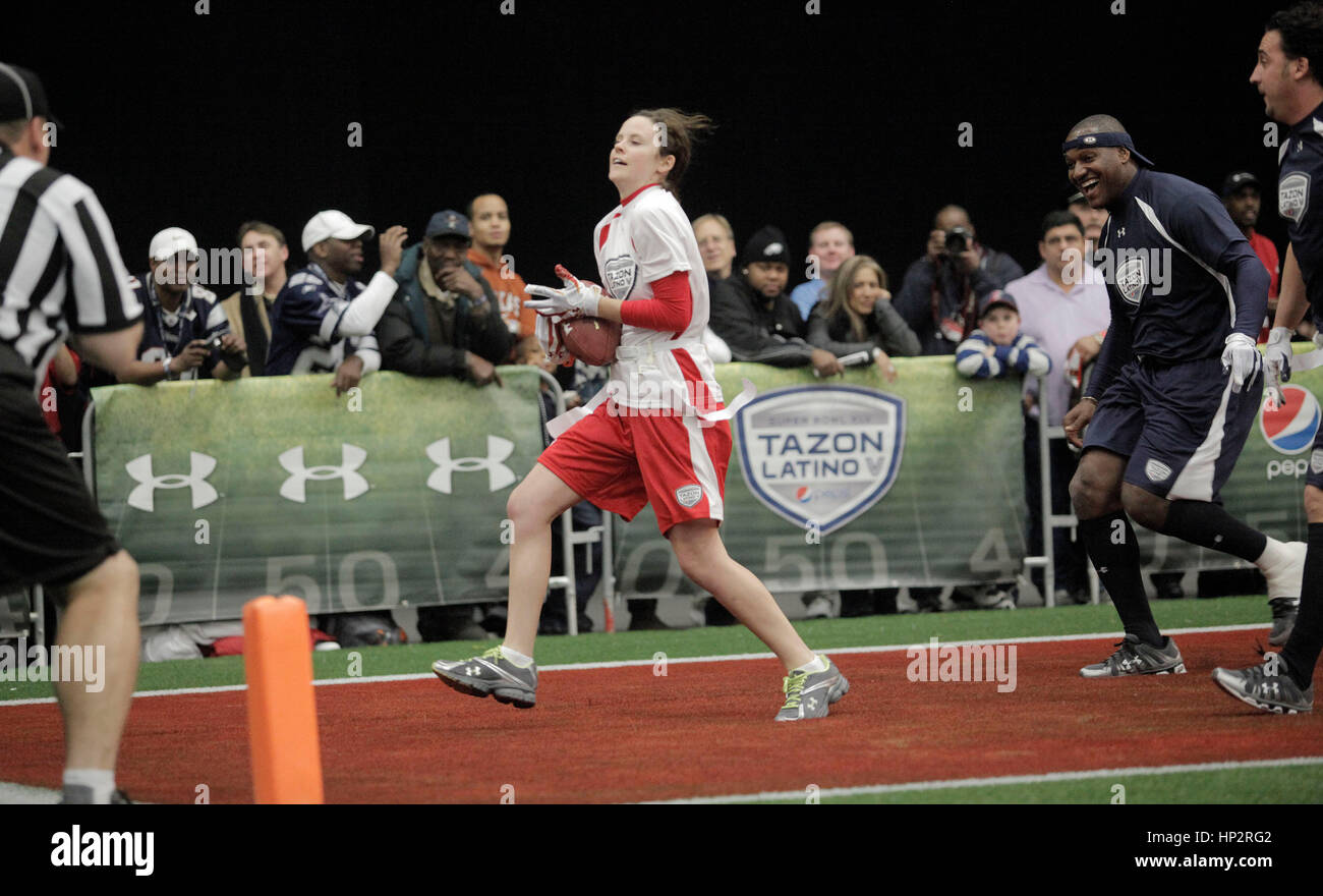 Sarah Ramos catches a touch down pass at the Tazon Latino V flag football game at Super Bowl NFL Experience at the Dallas Convention Center on February 2, 2011 in Dallas, Texas. Photo by Francis Specker Stock Photo