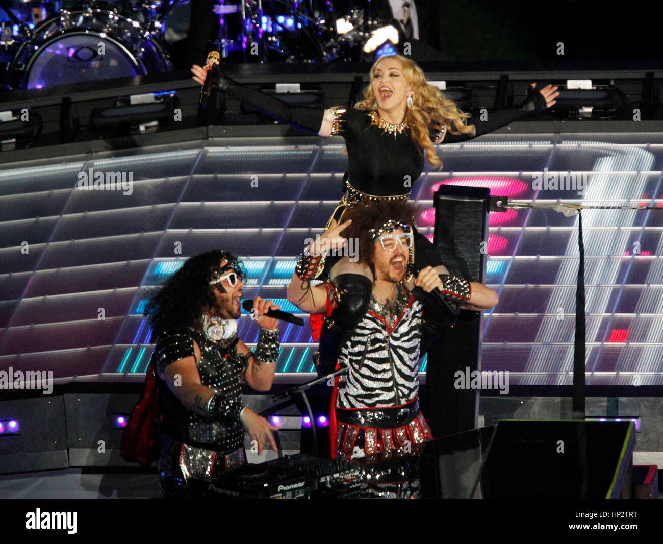 Madonna performs with LMFAO, (Redfoo) Stefan Kendal Gordy, (SkyBlu) Skyler Husten Gordy, at the half-time show during Super Bowl XLVI in Indianapolis, Indiana on February 5, 2012 Photo by Francis Specker Stock Photo