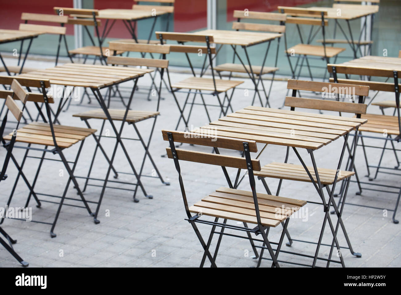 Restaurant empty sidewalk wooden tables Stock Photo