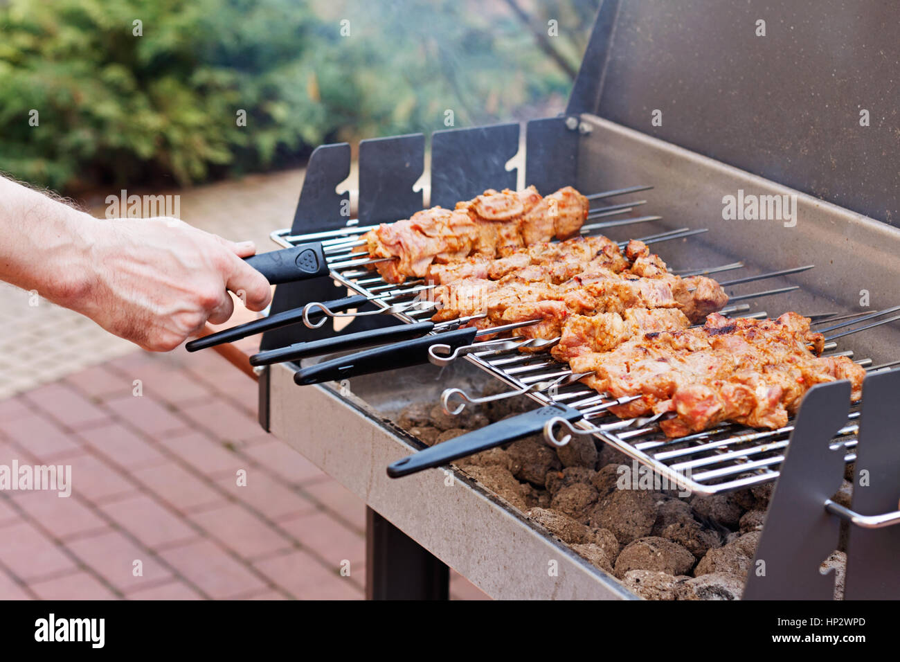 Close up of grill with barbecue in backyard Stock Photo - Alamy