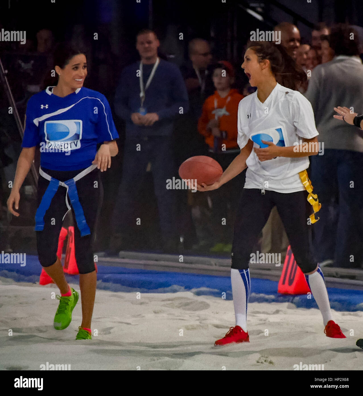Meghan Markle, left, with Nina Dobrev at Directv's 8th Annual Celebrity  Beach Bowl on February 1, 2014 in New York, NY. Photo by Francis Specker  Stock Photo - Alamy