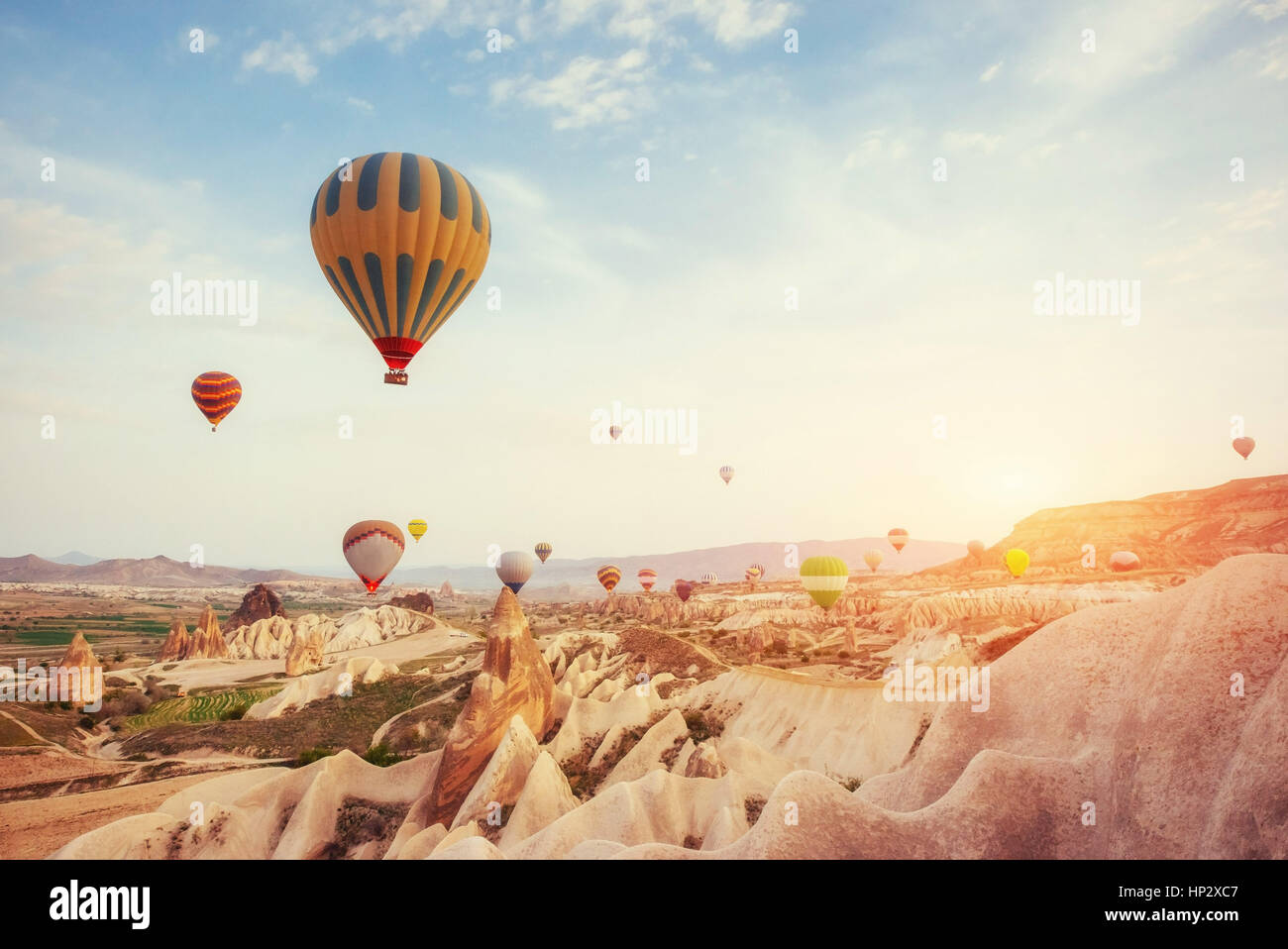 Hot air balloon flying over rock landscape at Turkey. Cappadocia Stock ...