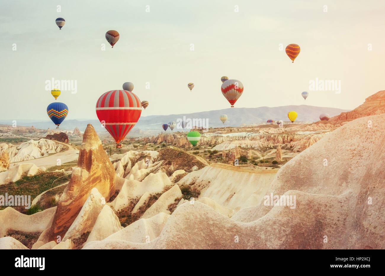 Colorful hot air balloons flying over Red valley at Cappadocia Stock ...