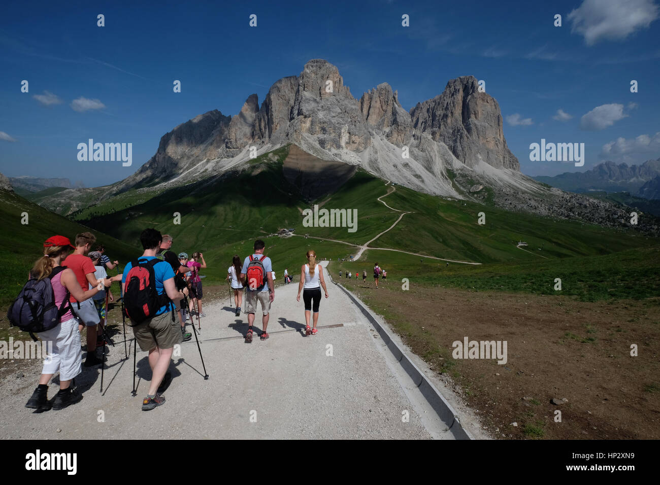 Group of hikers walking in the mountains.Outdoor adventure, wild journey and hiking, Summer Travel destination. Dolomites, Trentino Alto Adige, italy Stock Photo
